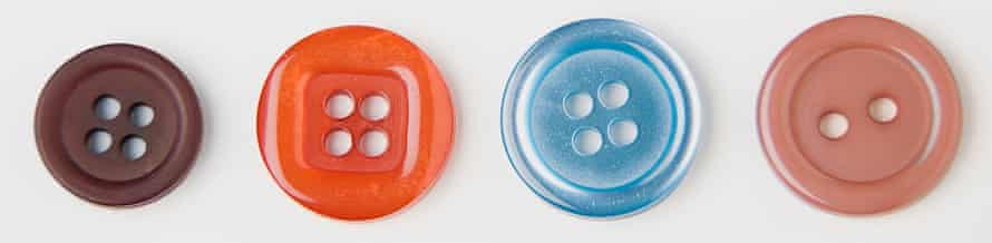 Close up of four buttons against white background