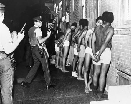 Members of the Philadelphia Black Panther Party are handcuffed and stripped during a police raid.