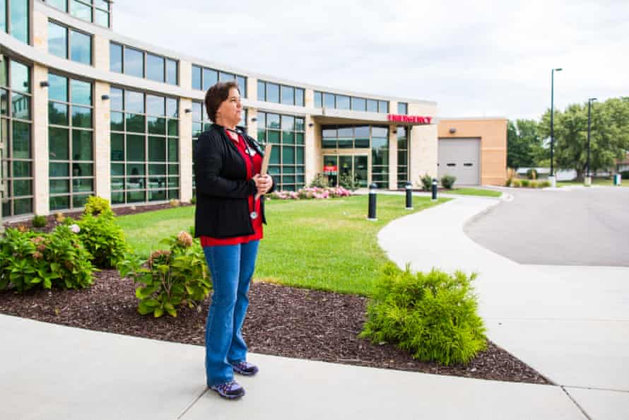 Having just finished her rounds, Dr Nancy Zidek stands at the entrance of the newly-opened community hospital in Onaga, Kansas.