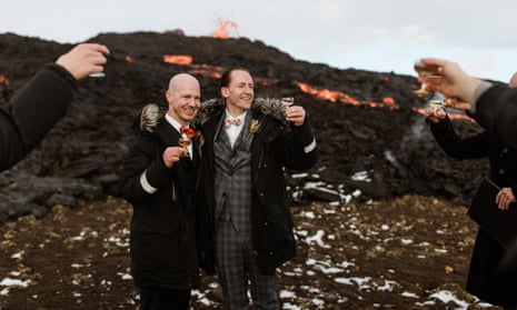 Jón, left, and Sumarliði tie the knot with the dramatic orange lava streams behind them.