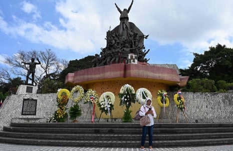 Woman standing in front of the People Power Monument in Quezon City