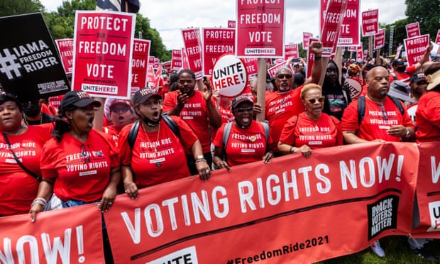 Hundreds of members of Unite Here!, a labor union for hospitality workers, march to the Freedom Ride for Voting Rights on the National Mall on Saturday.