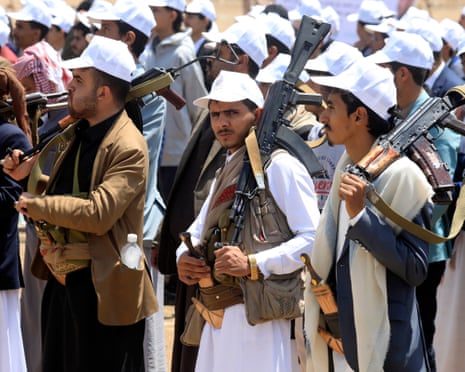 Armed students participate in a rally supporting the Houthi-imposed naval embargo against Saudi Arabia in Sana’a, Yemen, on Wednesday