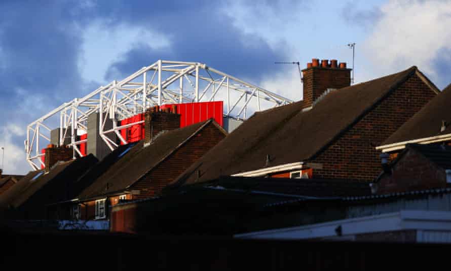 The stadium looms over local houses.