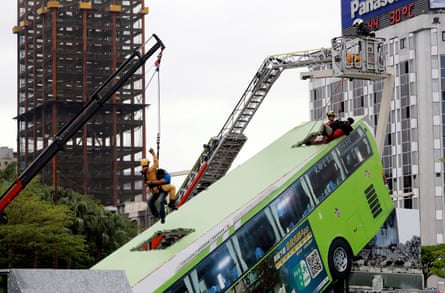 People practice rescue operations in a traffic accident scene during drills in Taipei