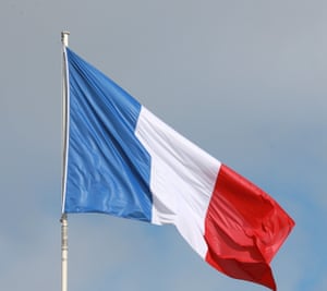 The French flag is pictured in the sky over the Elysee Palace in Paris