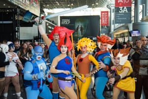 Attendees dressed as Thunder Cats characters walk the floor of Comic Con