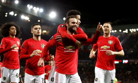 Manchester United’s Juan Mata (centre) celebrates scoring his sides third goal with teammates.