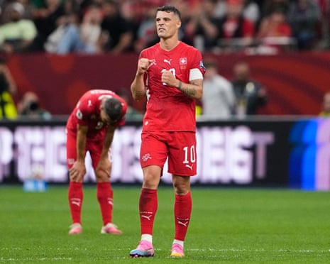 Granit Xhaka celebrates as Switzerland beat Algeria in the World Cup knockout match