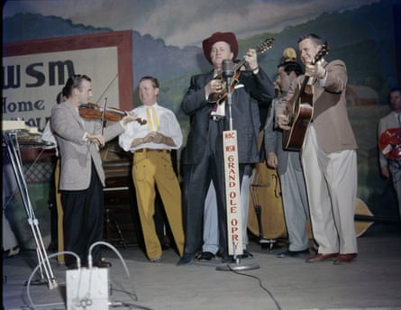 Bill Monroe on stage at the Grand Ole Opry, Nashville, c.1958.