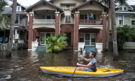 Justin Hand kayaks through Jacksonville after record flooding from storm surges after Hurricane Irma