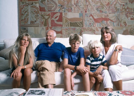 five people sitting on a couch
