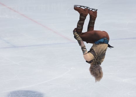 Ilia Malinin eyes the landing on his backflip in the short program.