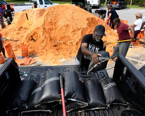 Residents pick up sandbags for storm preparation at the James Seals Jr. Parks & Recreation Center in Mobile, Alabama.