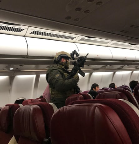 Armed personnel on Flight MH128 after the plane returned to Melbourne