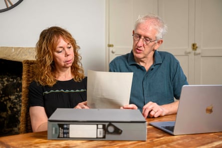 Annette and Kevin Maxwell go through the paperwork on their case