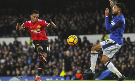 Manchester United’s Anthony Martial curls in the opener against Everton.