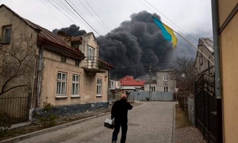 Smoke pours from a fire at an industrial facility after Russian military attack in the area on Saturday.