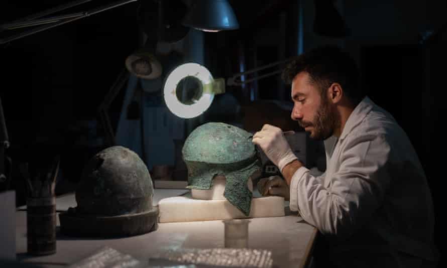 Marco Iovinella, a restorer working on two helmets found in Velia that were probably used during the battle of Alaia in the sixth century BC.