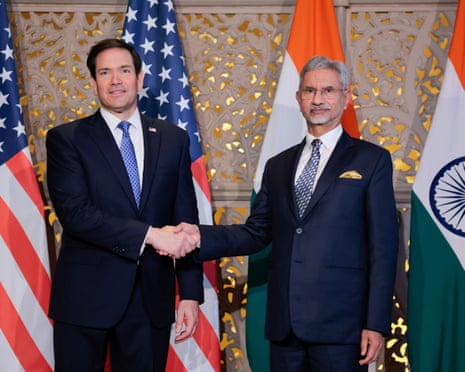 Marco Rubio and Subrahmanyam Jaishankar shake hands in front of American and Indian flags