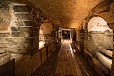A walkway among ancient catacombs