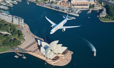 A Qantas Airbus A350-1000 flight test aircraft flies over Sydney Harbour
