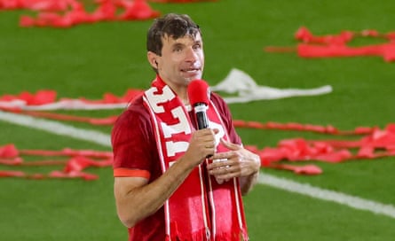 Thomas Müller talks to the Bayern fans after being drenched in beer at his farewell party.
