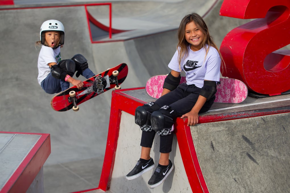 Sky Brown, 11, poses for a picture at Vans Off The Wall Huntington Beach skatepark as her brother Ocean, 8, photobombs the picture.