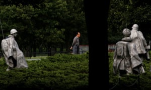 People walk through the Korean war veterans memorial in Washington, DC.