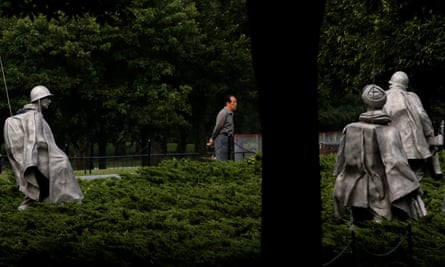 People walk through the Korean war veterans memorial in Washington, DC.