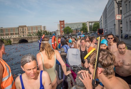 People in swimming suits next to Spree River