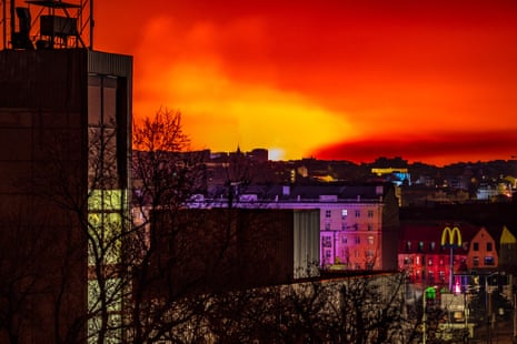 This general view taken on 30 March shows fire and smoke lighting up the night sky, east of Kharkiv.