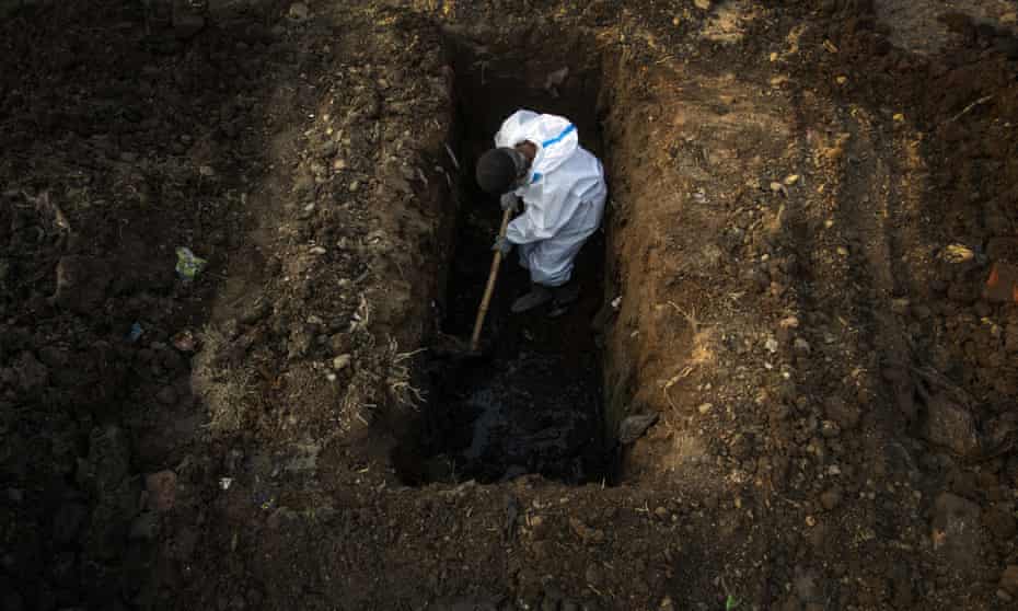 Burying a person who died of Covid-19 in Gauhati, India April 2021