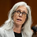 a woman speaks into a microphone