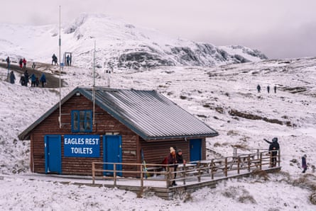 Hut in snow saying Eagles Rest Toilets