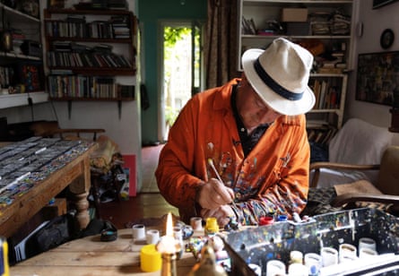 Wilson paints a tile piece at his home studio in Muswell Hill, London.
