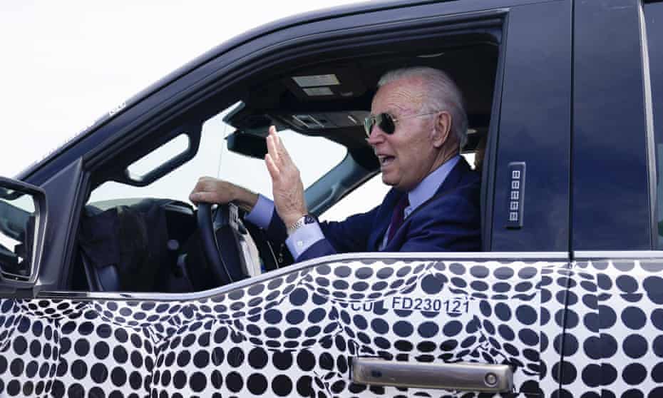 Biden in the electric Ford F150 in Dearborn in May. The president wants to dramatically increase the number of electric vehicles on the road and the infrastructure for manufacturing them.