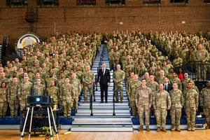 Secretary of the army Dan Driscoll poses with soldiers and airmen from the District of Columbia National Guard at the D.C. National Guard Armory in Washington on Tuesday.