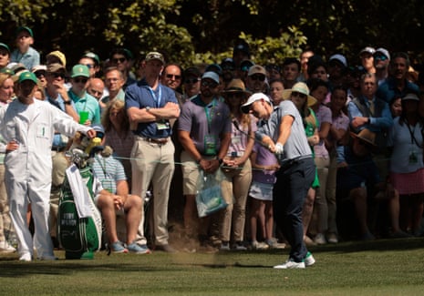Rory McIlroy hits his approach on the 1st hole.