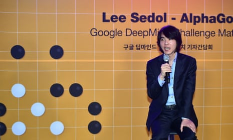 Lee Se-Dol, a legendary South Korean player of Go - a board game widely played for centuries in East Asia - speaks beside a backdrop of a Go board and its pieces (L) during a press briefing on the Google DeepMind Challenge Match at Korea Baduk Association in Seoul on February 22, 2016