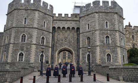 Wardens stand outside the gates of Windsor Castle on Friday 9 September, the day after the Queen’s death.