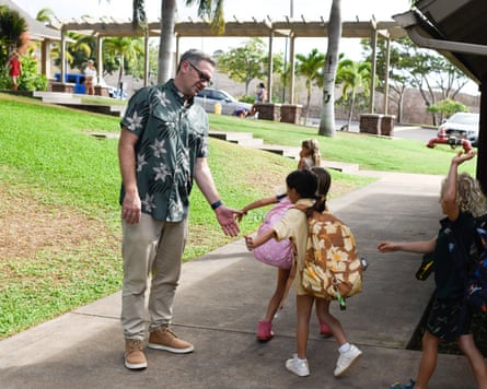 Kirkham high-fives young children on the pavement outside