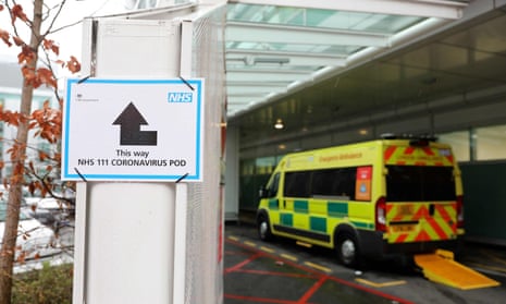 A sign directs patients towards an NHS 111 Coronavirus Pod at St Thomas’ Hospital in London