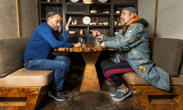 Comedians Geoff Norcott and Rufus Hound chatting at a table at Hide restaurant in London