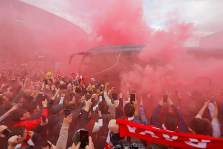 Arsenal fans greet the team bus before kick-off against Burnley.