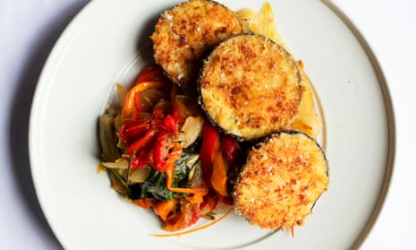 ‘Keep the heat moderate so that the juices from the peppers and fennel don’t evaporate’: crumbed aubergines with peppers and fennel.