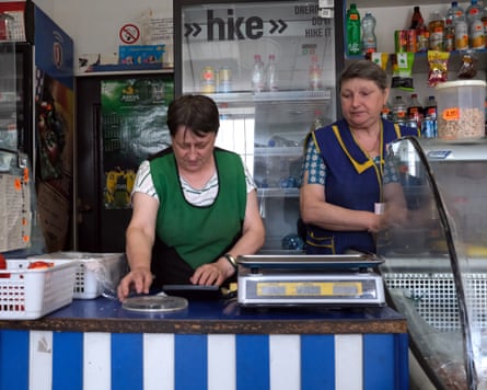 Natalia Lanna and Svitlana Sotvykova behind the counter of the mini-market they run