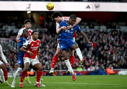 Arsenal’s Declan Rice wraps his arms around Jorrel Hato in the Premier League match against Chelsea