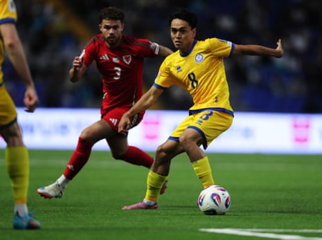 Kazakhstan's Ramazan is tracked by Neco Williams.