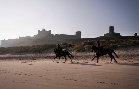 Minella Study and a stablemate are put through their paces on the beach at Bamburgh